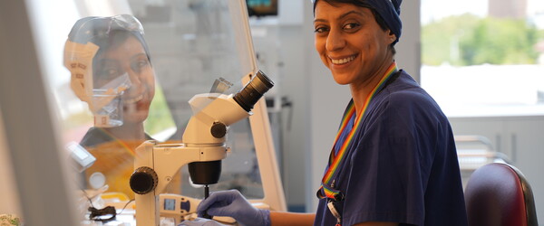embryologist looking at camera